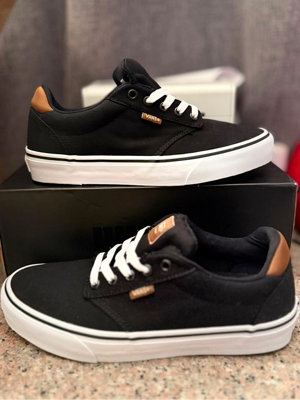 Vans Black Low-Top Sneakers with Brown Heel Tabs and White Laces